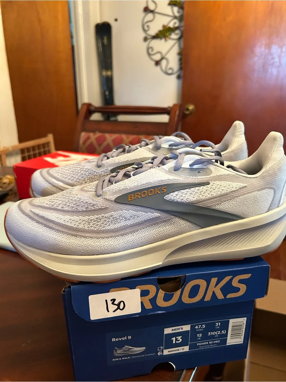 Men’s Brooks light gray and blue knit running shoes with gum outsole
